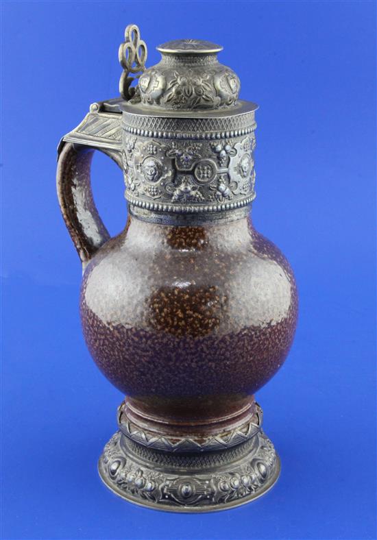 An Elizabethan style tiger ware jug, George V silver mounts, 9.75in.